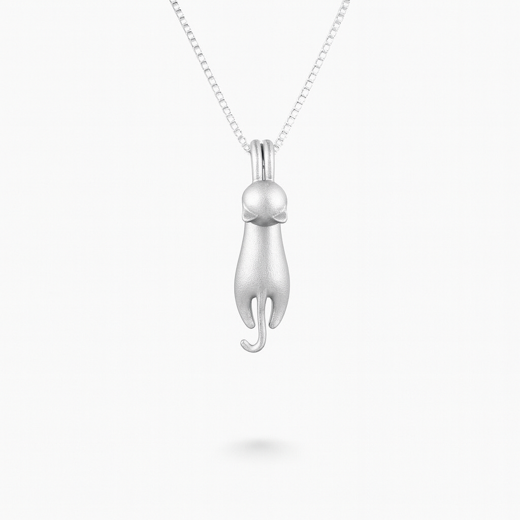 Silver cat pendant necklace on a delicate chain, minimalist jewelry design, perfect for cat lovers, elegant accessory for everyday wear.