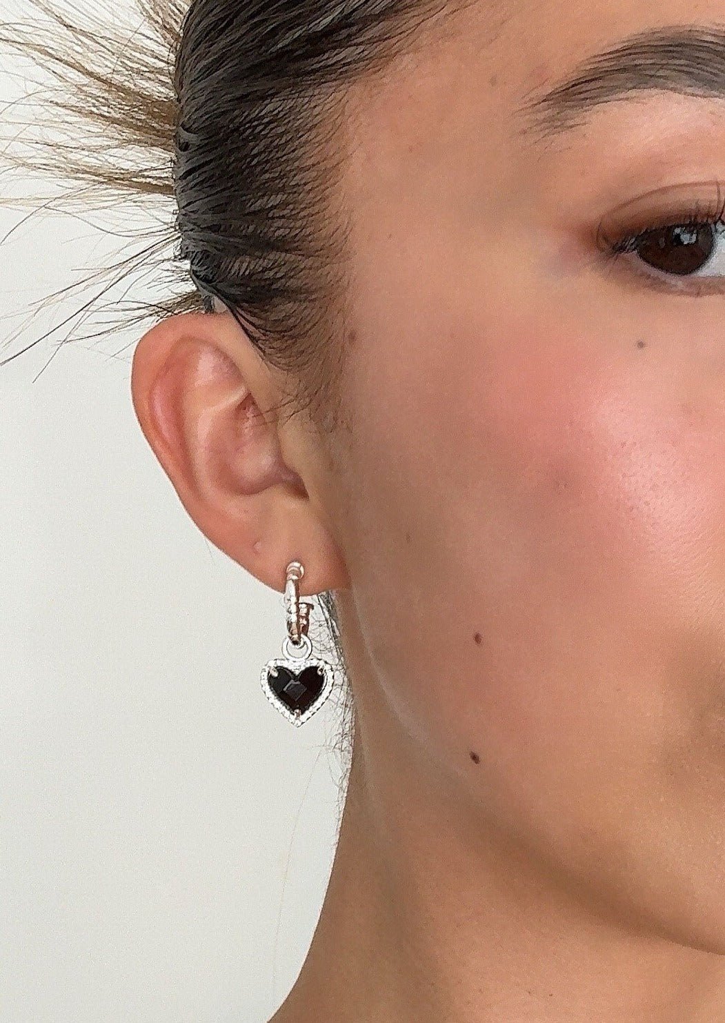 Silver Tone Heart Drop Earrings with Black Center Stone