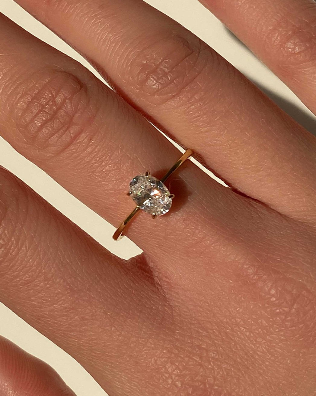 Gold Ring with Oval-Cut Center Stone