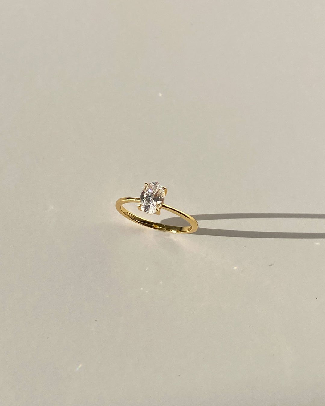 Gold Ring with Oval-Cut Center Stone