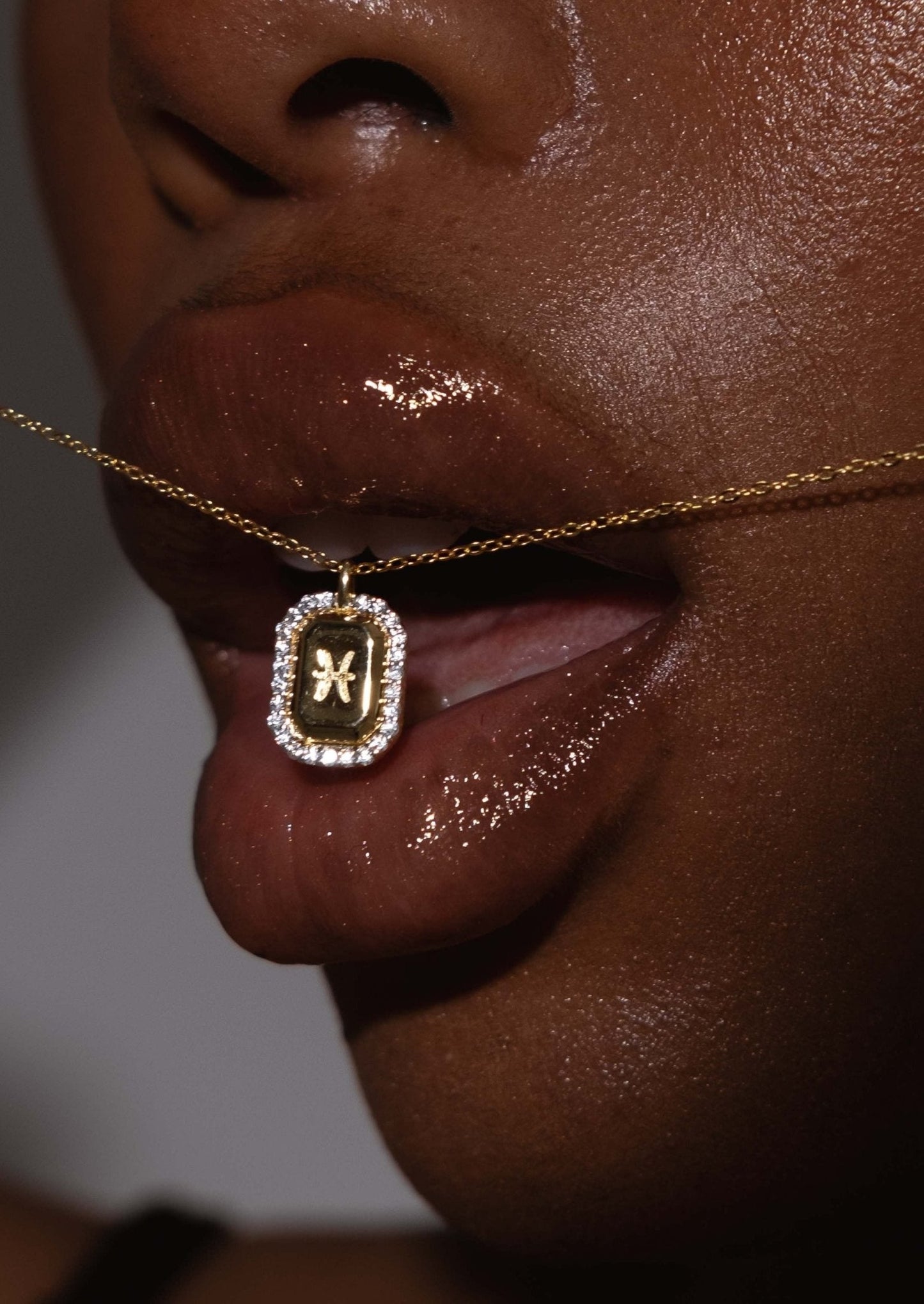 Gold-Toned Zodiac Pendant Necklace with Clear Stone Border