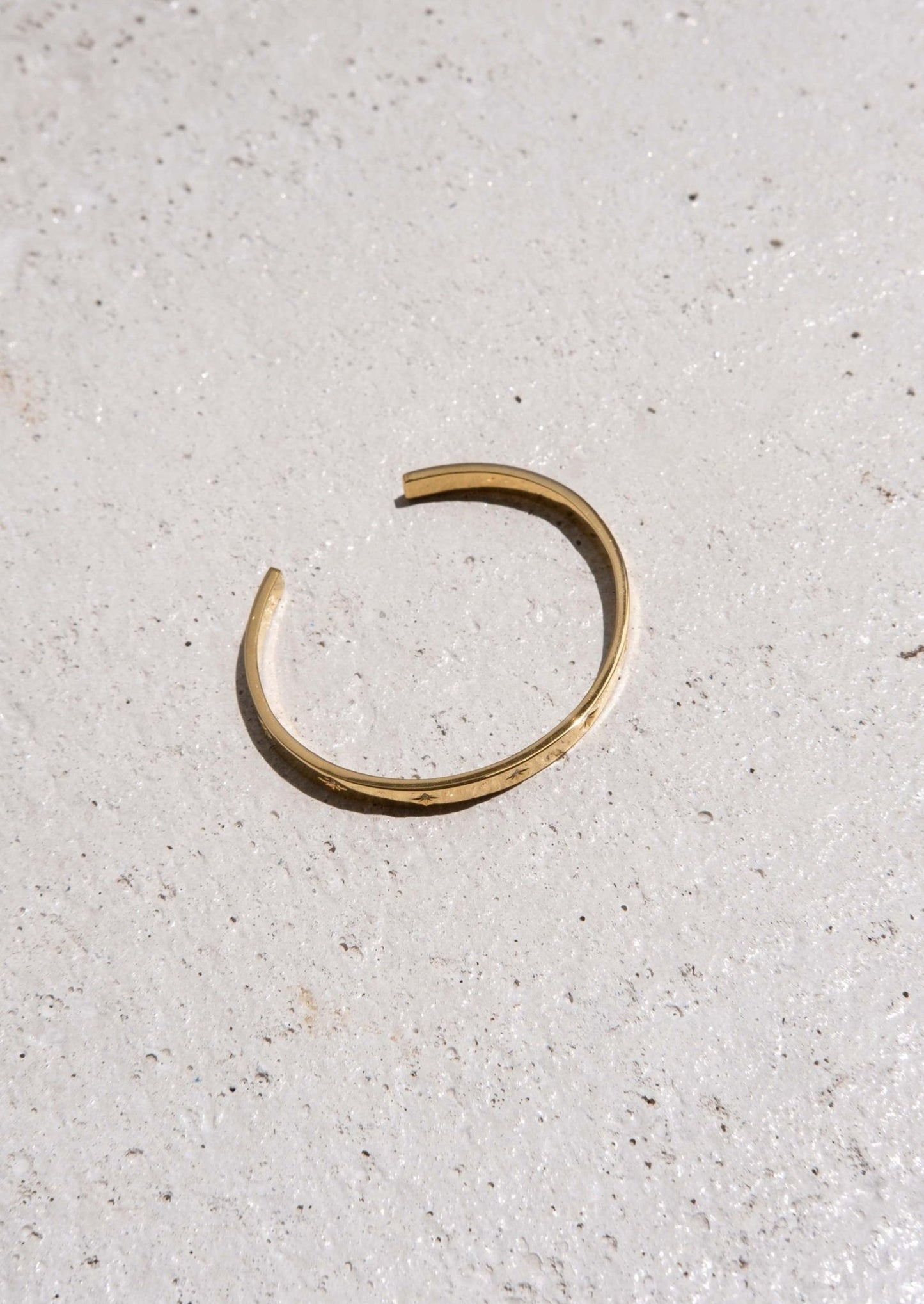 Gold Bangle Bracelet with Star-Set Detailing