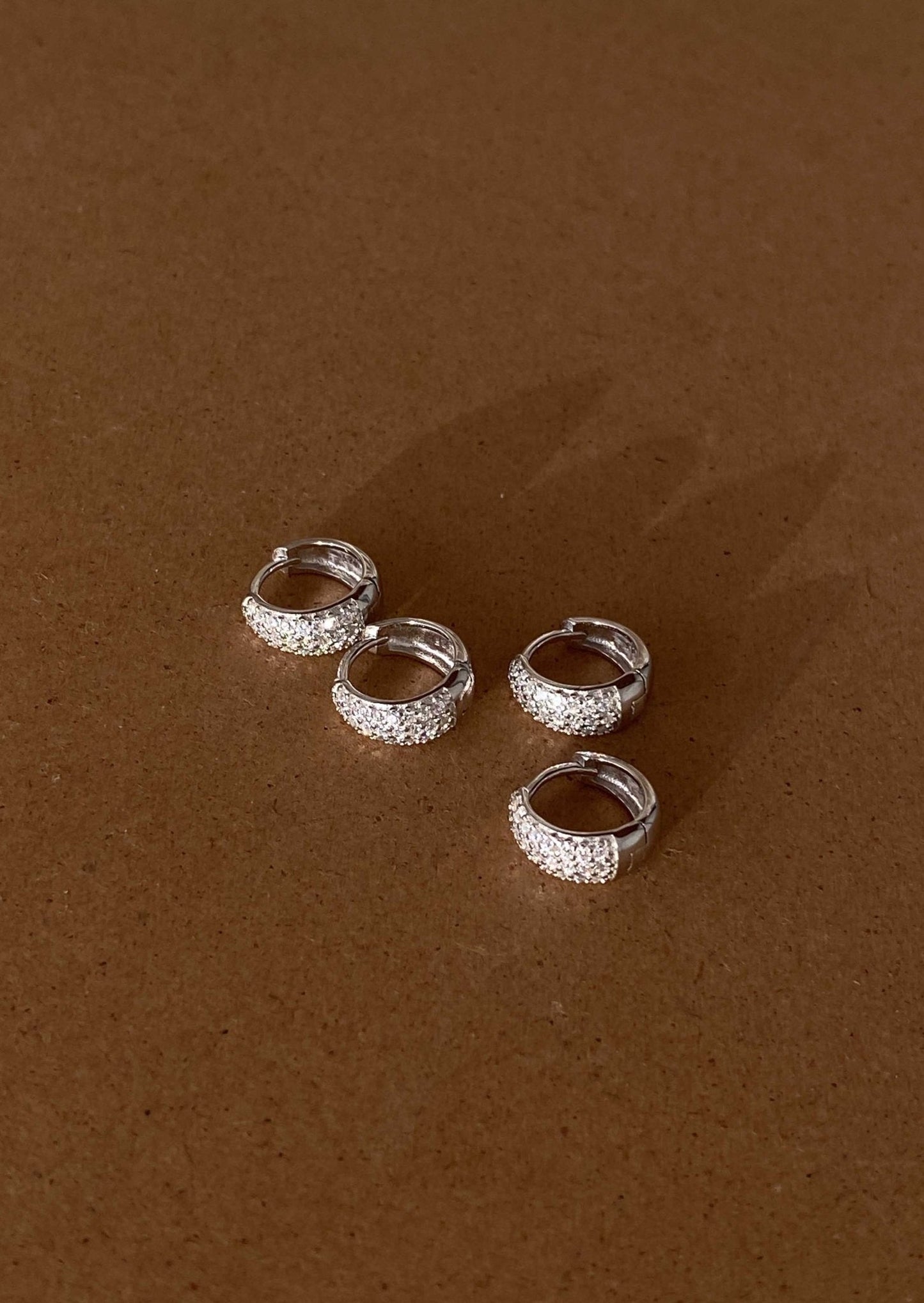 Nora Huggie Earrings – Sterling Silver with CZ Accents