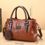 Brown handbag with measurements on a beige background