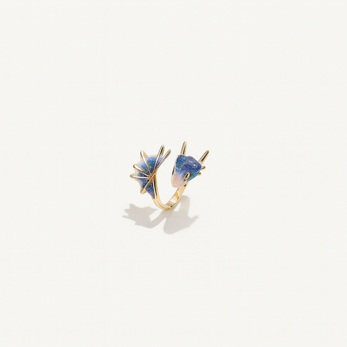 Gold ring with two blue gemstone accents, featuring unique geometric designs. Elegant jewelry piece, perfect for fashion accessories and style enthusiasts.