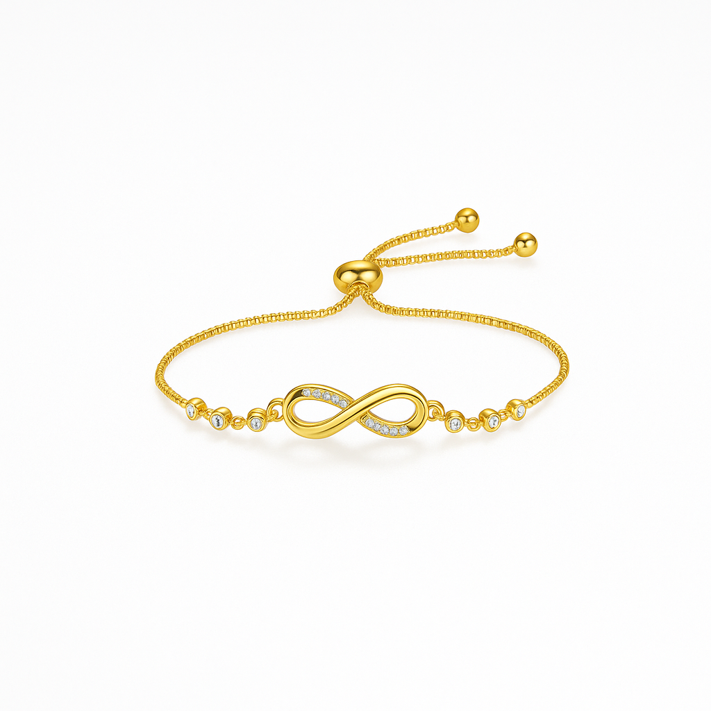 Gold infinity bracelet with adjustable chain and diamond accents on white background. Elegant jewelry, perfect for gifts and fashion accessories.