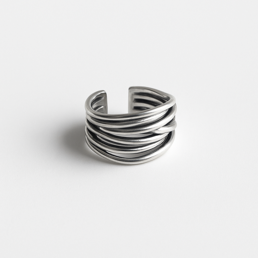 Silver multi-band open cuff ring on white background, minimalist jewelry design, modern fashion accessory, unisex statement piece.