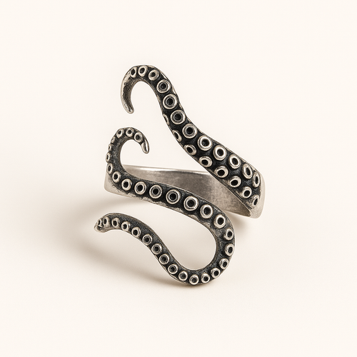 Silver octopus tentacle ring on a light beige background
