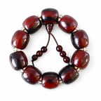 Brown beaded bracelet on a white background