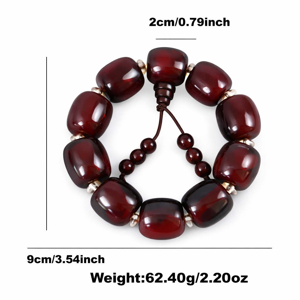 Red beaded bracelet with measurements on a white background