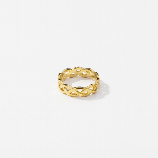 Gold ring with a braided design on a white background