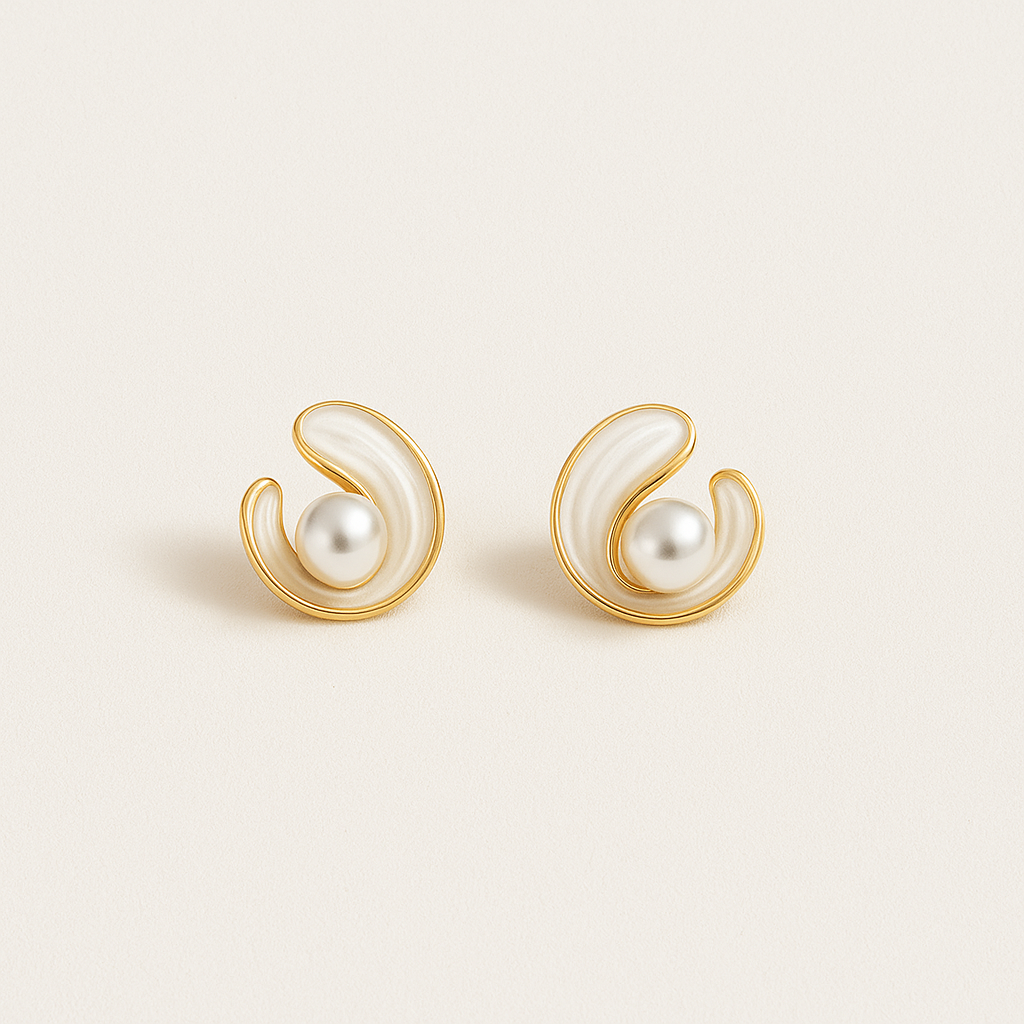 Elegant gold and pearl swirl earrings on a white background, showcasing luxury jewelry design, perfect for fashion accessories and style enthusiasts.