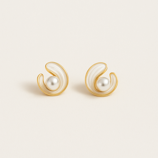 Elegant gold and pearl swirl earrings on a white background, showcasing luxury jewelry design, perfect for fashion accessories and style enthusiasts.