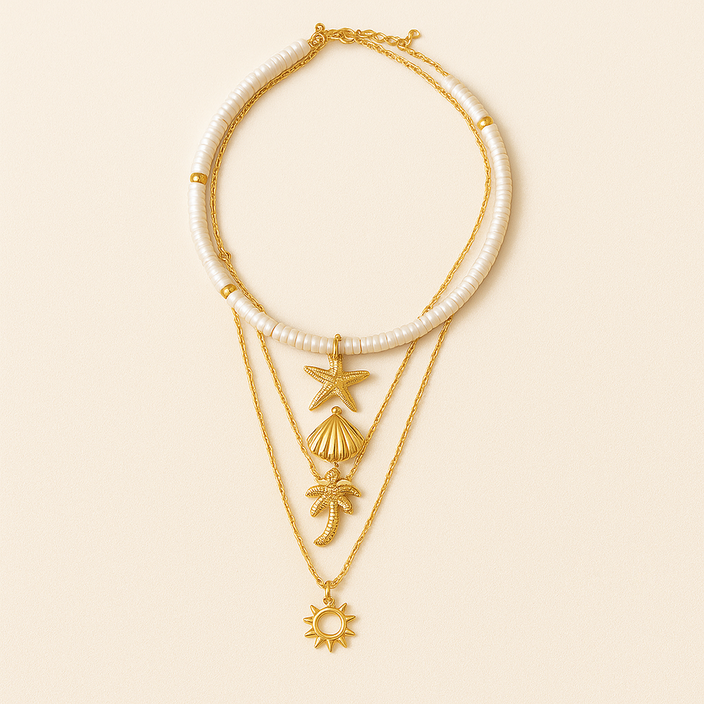 Gold layered necklace with seashell, starfish, palm tree, and sun charms on a beige background. Boho beach jewelry, summer fashion accessory.