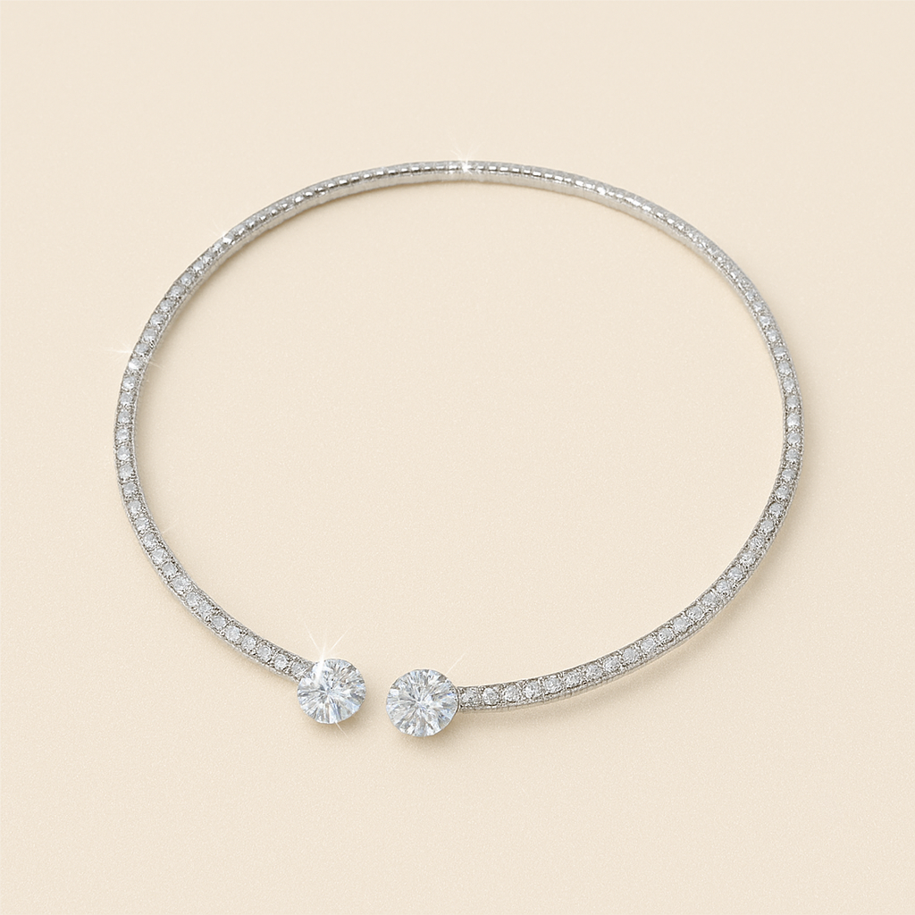 Elegant diamond-studded open bangle bracelet with two large round diamonds, luxury jewelry, sparkling gemstones, minimalist design on beige background.