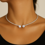 Elegant diamond choker necklace on woman's neck, featuring two large round diamonds and a row of smaller diamonds, perfect for luxury fashion.