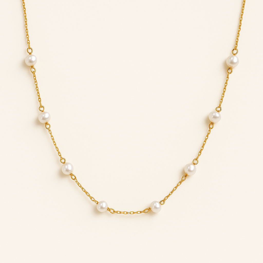 Gold chain necklace with evenly spaced white pearls, elegant jewelry design, minimalist style, perfect for fashion accessories and gift ideas.