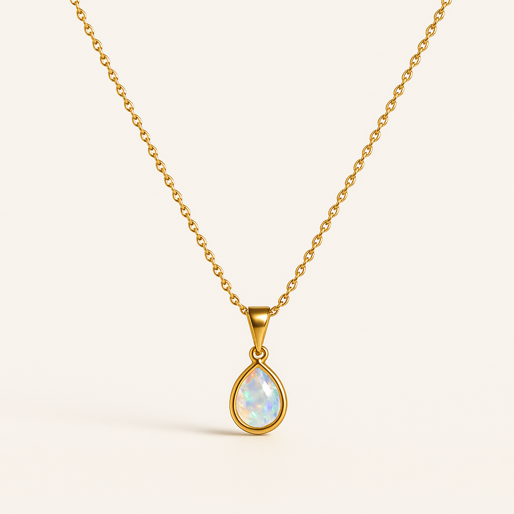 Gold chain necklace with a teardrop opal pendant, showcasing iridescent colors. Elegant jewelry piece, perfect for fashion and style enthusiasts.