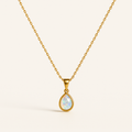 Gold chain necklace with a teardrop opal pendant, showcasing iridescent colors. Elegant jewelry piece, perfect for fashion and style enthusiasts.