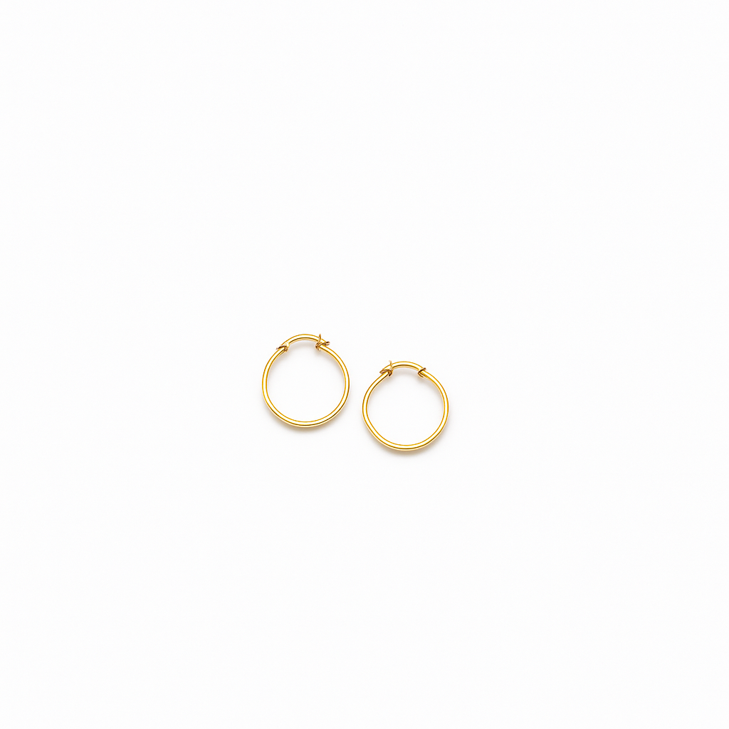 Gold hoop earrings on white background, minimalist jewelry, small round hoops, elegant fashion accessory, women's gold earrings, simple design.