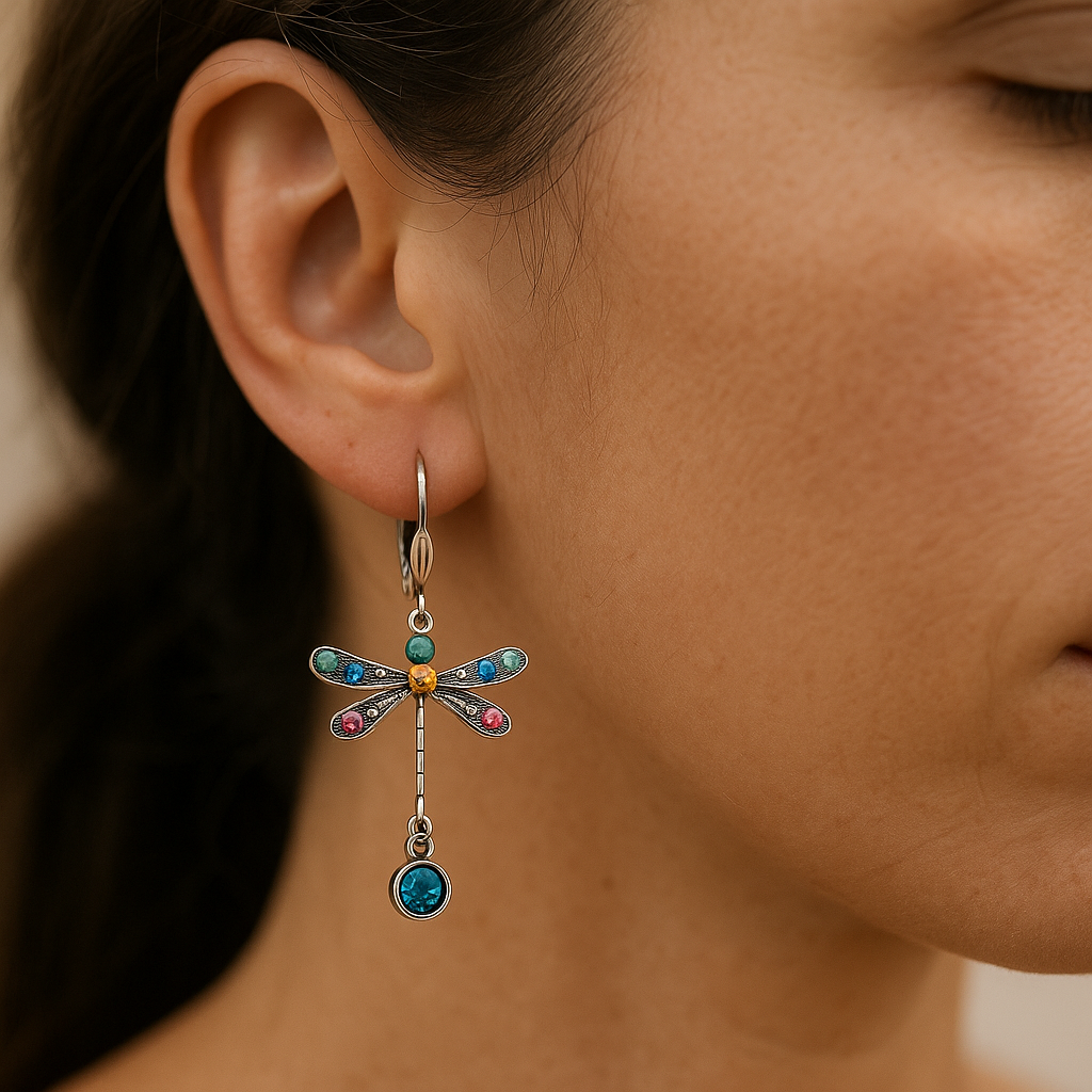 Close-up of a woman wearing a colorful dragonfly-shaped earring.