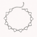 Silver necklace with heart-shaped links on a white background