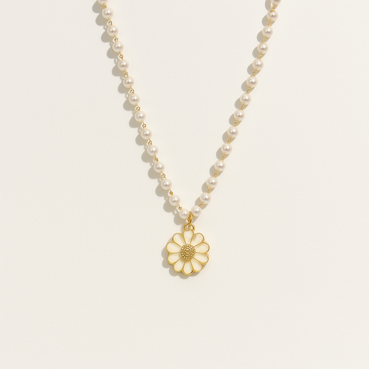 Pearl necklace with gold daisy pendant, elegant jewelry, luxury fashion accessory, classic pearl strand, floral charm, sophisticated style.