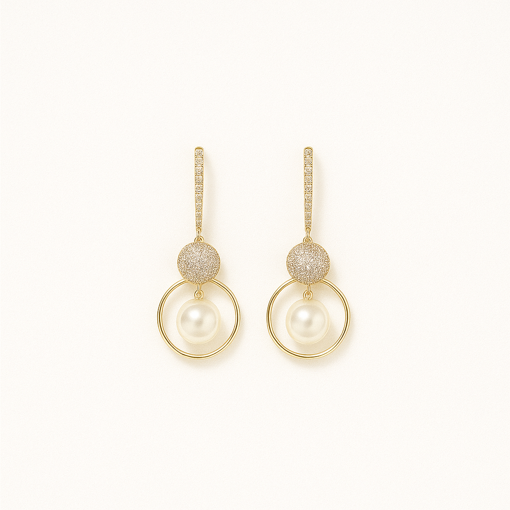 Elegant gold drop earrings with sparkling crystals and round pearls, perfect for weddings or formal events. Luxurious jewelry accessory.