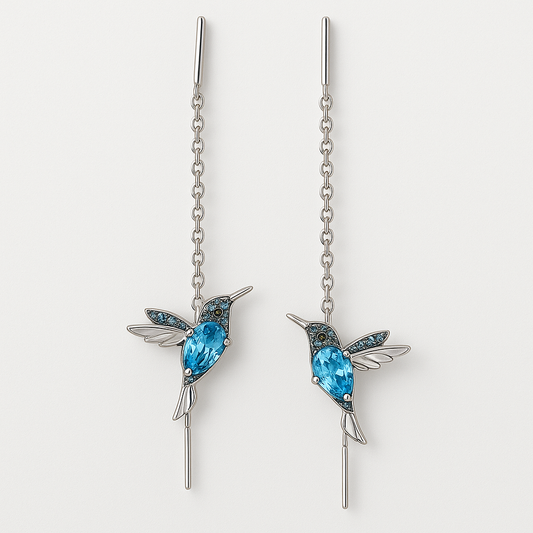 Elegant silver hummingbird earrings with blue gemstones, featuring intricate chain design. Perfect for fashion accessories, jewelry lovers, gift ideas.