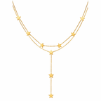 Gold star necklace on a white background