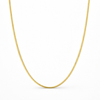 Gold chain necklace on a white background