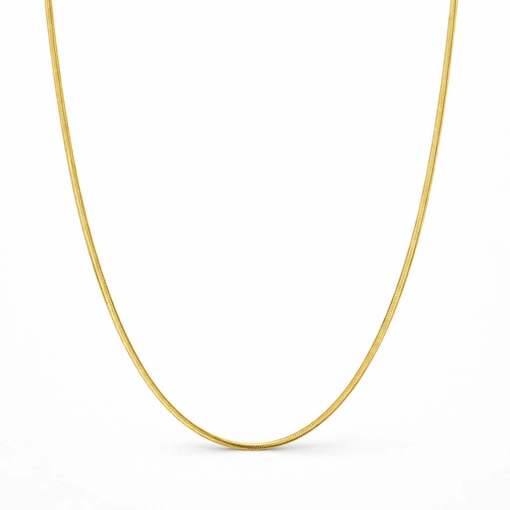 Gold chain necklace on a white background