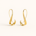 Gold earrings on a white background