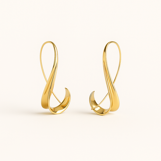 Gold earrings on a white background