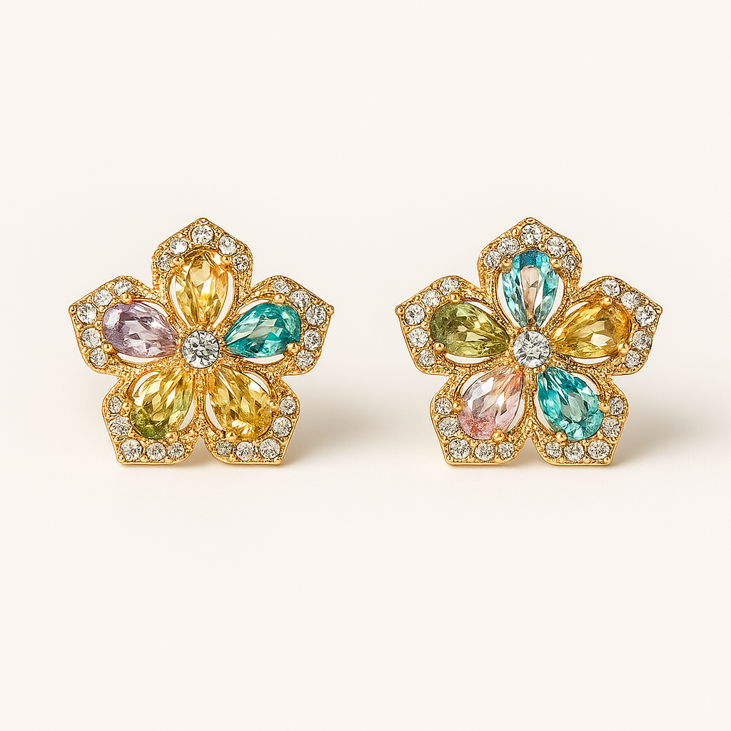 Pair of floral earrings with multicolored gemstones on a white background