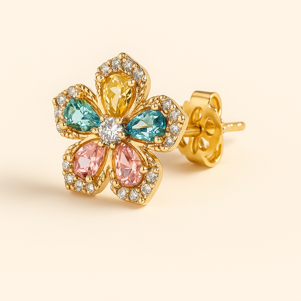 Gold earring with colorful gemstones on a beige background