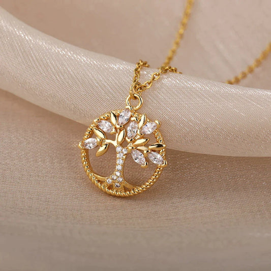 Gold tree of life pendant necklace with sparkling cubic zirconia stones on a delicate chain, elegant jewelry piece for women, gift idea.
