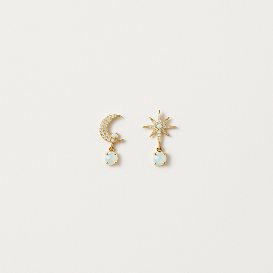 Gold moon and star earrings with opal gemstones, featuring a crescent moon and starburst design, perfect for celestial-themed jewelry lovers.