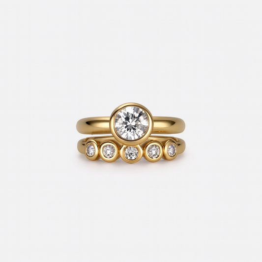Gold ring with diamond on a light gray background