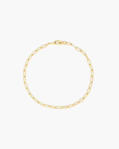 Gold paperclip chain bracelet with lobster clasp on white background, minimalist jewelry, elegant fashion accessory, women's gold bracelet.