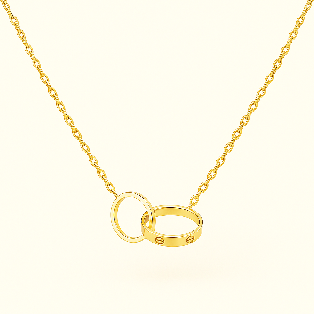Gold necklace with interlocking rings pendant, featuring a sleek design. Perfect for elegant jewelry collections and fashion accessories.