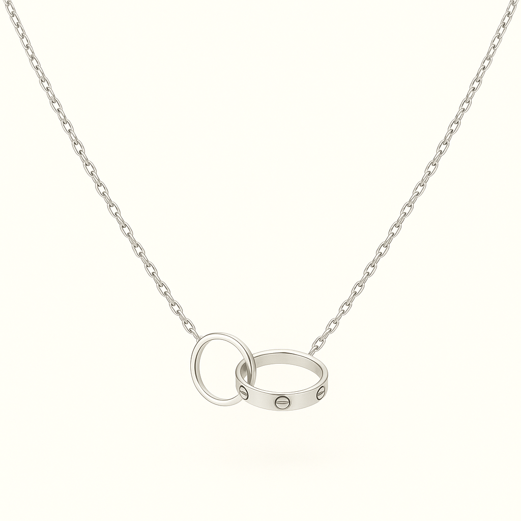 Silver chain necklace with interlocking rings, featuring a sleek design and minimalist style. Perfect for fashion-forward jewelry enthusiasts.