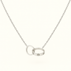 Silver chain necklace with interlocking rings, featuring a sleek design and minimalist style. Perfect for fashion-forward jewelry enthusiasts.