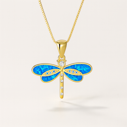 Gold dragonfly pendant necklace with blue opal wings and diamond accents, elegant jewelry design, perfect for fashion accessories and gift ideas.