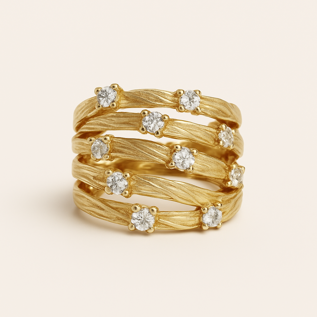 Gold ring with diamond stones on a beige background