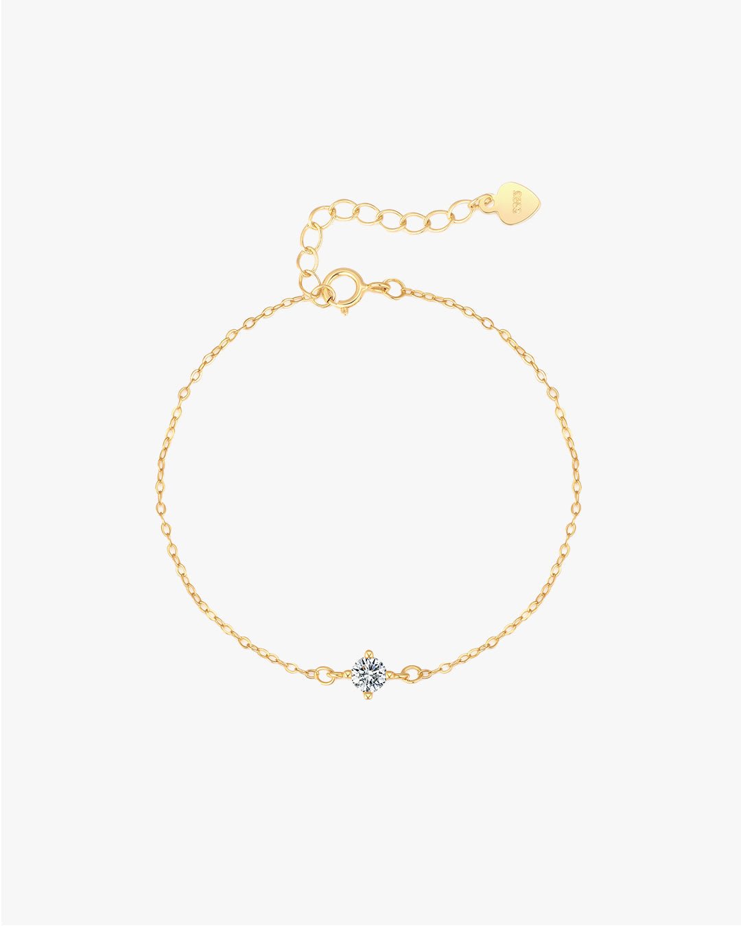 Gold chain bracelet with a central diamond flower pendant, adjustable clasp, and heart-shaped tag. Elegant jewelry accessory for women.