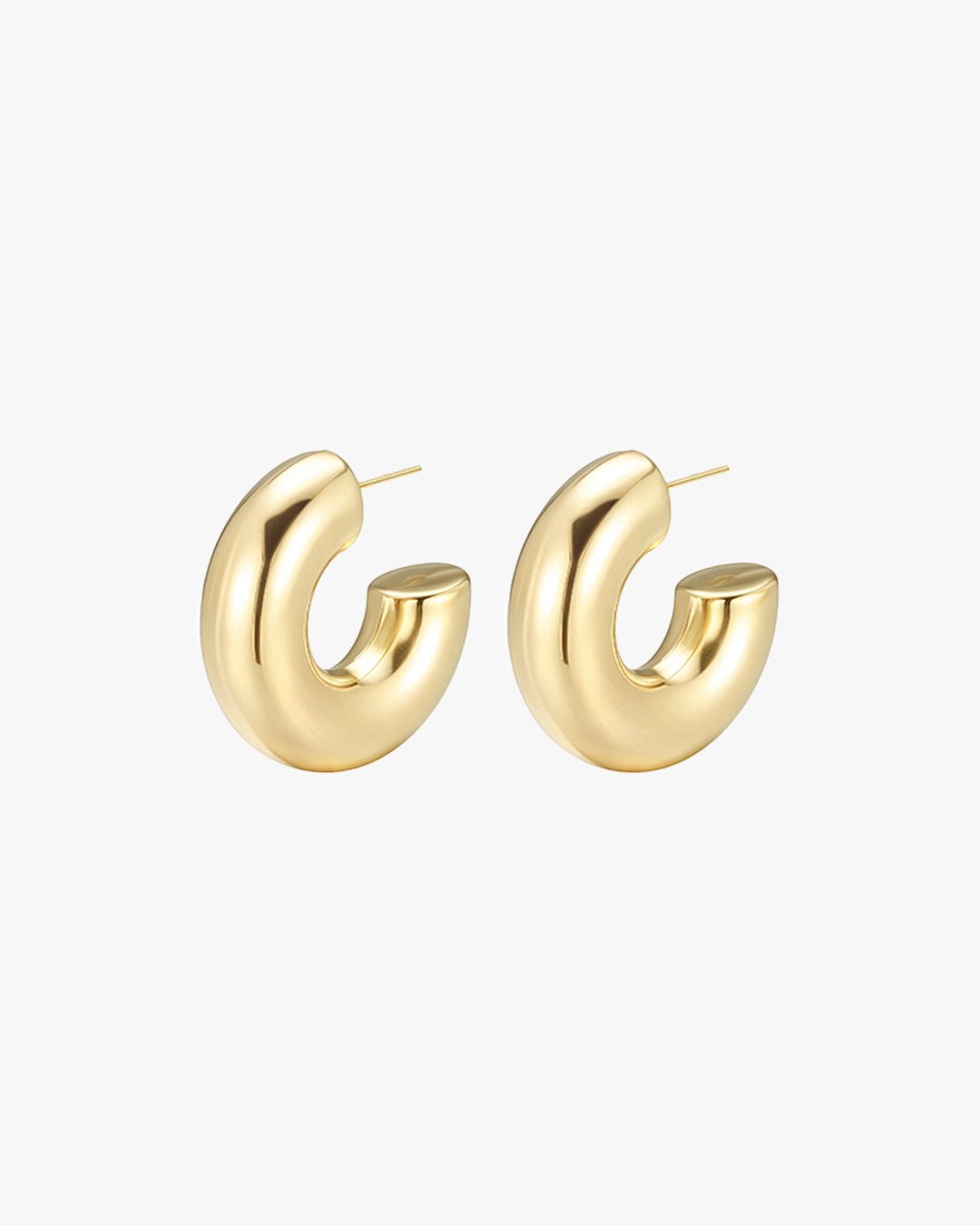 Gold hoop earrings with a chunky, modern design on a white background. Fashion jewelry, statement accessory, elegant style.