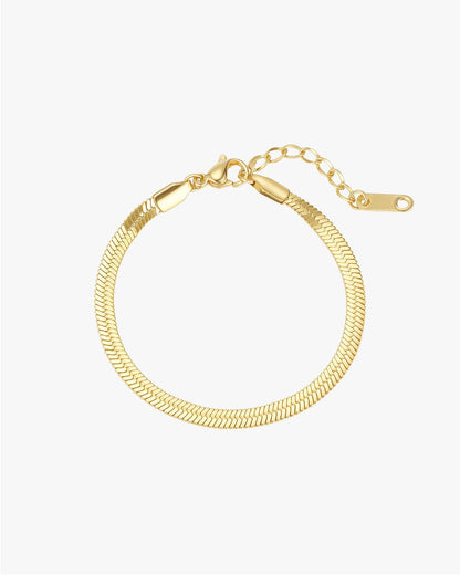 Gold herringbone chain bracelet with lobster clasp and adjustable extender, elegant jewelry accessory, perfect for fashion and style enthusiasts.