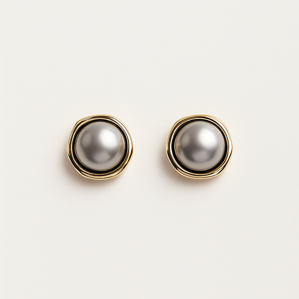 Elegant gold and silver pearl stud earrings on white background, luxury jewelry, fashion accessories, classic design, women's earrings.