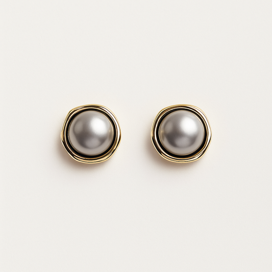 Elegant gold and silver pearl stud earrings on white background, luxury jewelry, fashion accessories, classic design, women's earrings.